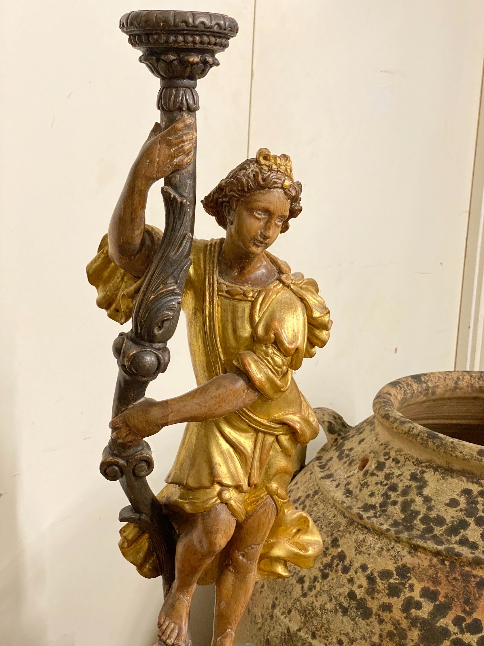 A pair of 18th century style carved pine parcel gilt figural lamp bases, height 75cm